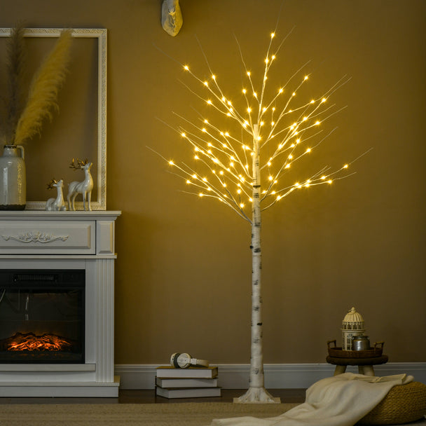 6ft Pre-Lit White Birch Tree illuminated in a room