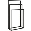 Black freestanding steel towel rack with three bars at staggered heights