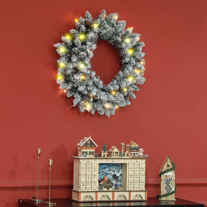 60cm Snowy Christmas Wreath in a Christmas room setting