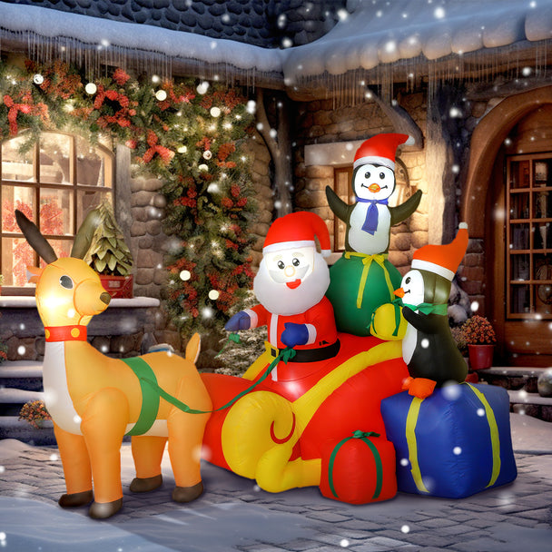 6ft Santa Sleigh and Penguin Christmas Inflatable displayed outside a decorated home