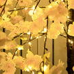 Artificial Pink Blossom Tree illuminated at night