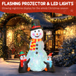 Illuminated 6ft snowman and penguins Christmas inflatable at night