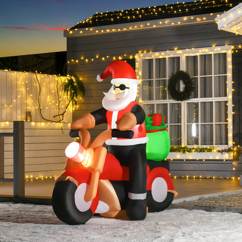 5.5ft Santa on Motorcycle Christmas Inflatable displayed outside a decorated home