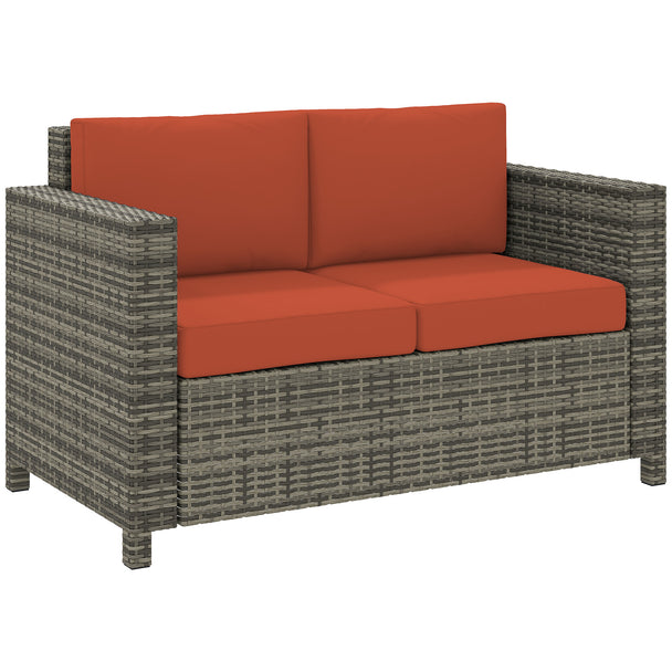 Grey two-seater rattan garden sofa with orange cushions