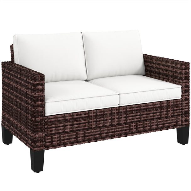 Brown two-seater rattan garden sofa with thick cream cushions