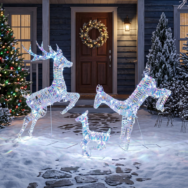 3-Piece Iridescent Light-Up Reindeer Family illuminated outside a decorated home