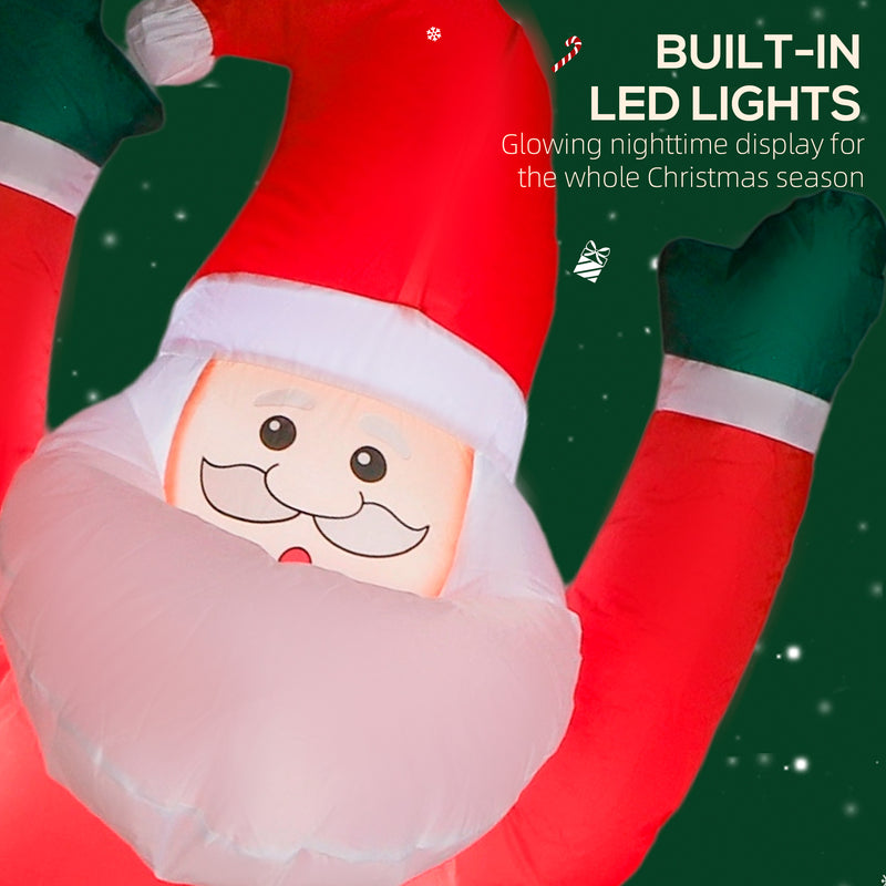 Illuminated 7ft hanging Santa and dog Christmas inflatable at night