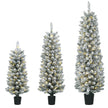 Set of three slim snowy pre-lit pencil Christmas trees glowing with warm white LEDs