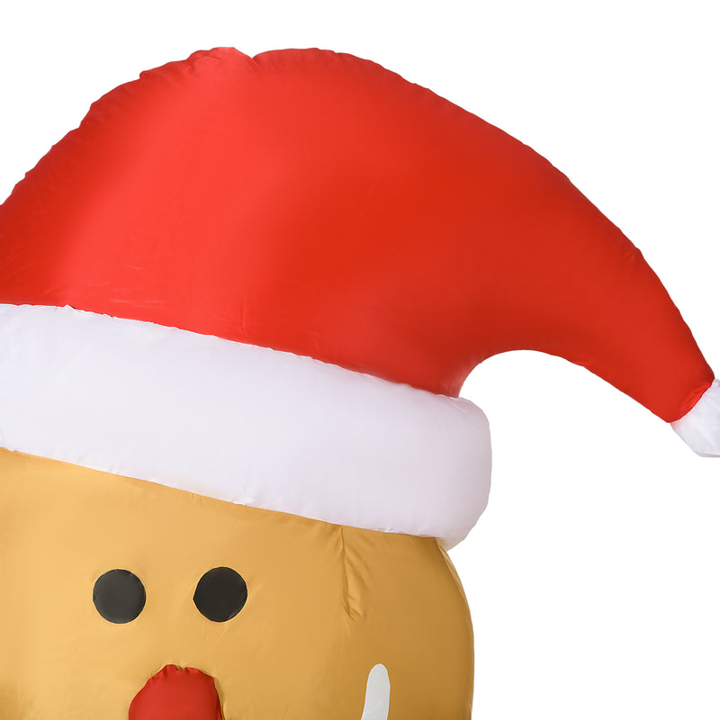 Close-up of a decorative detail on the 6ft gingerbread man in Santa hat Christmas inflatable