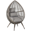 Grey teardrop rattan egg chair on four legs with thick grey cushion
