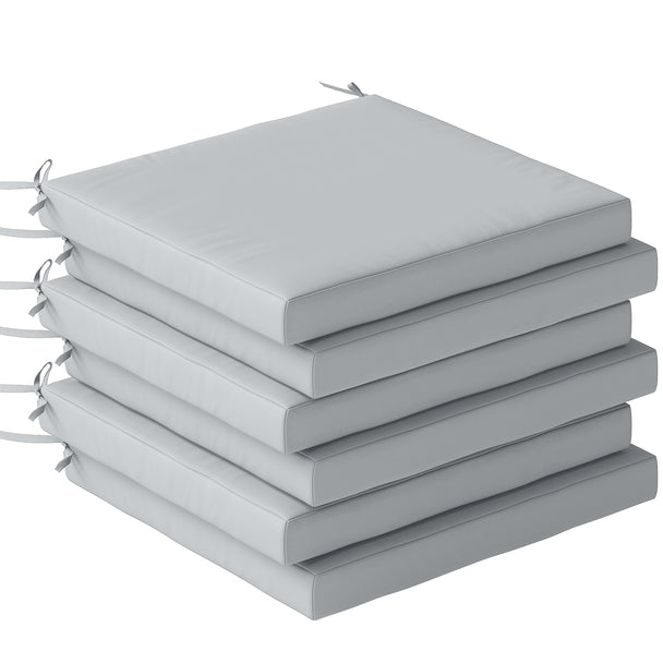 Six light grey 46 x 42 cm garden seat cushions with ties on dining chairs