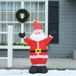 4ft Santa Christmas Inflatable displayed outside a decorated home