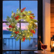 60cm Pre-Lit Christmas Wreath hanging on display