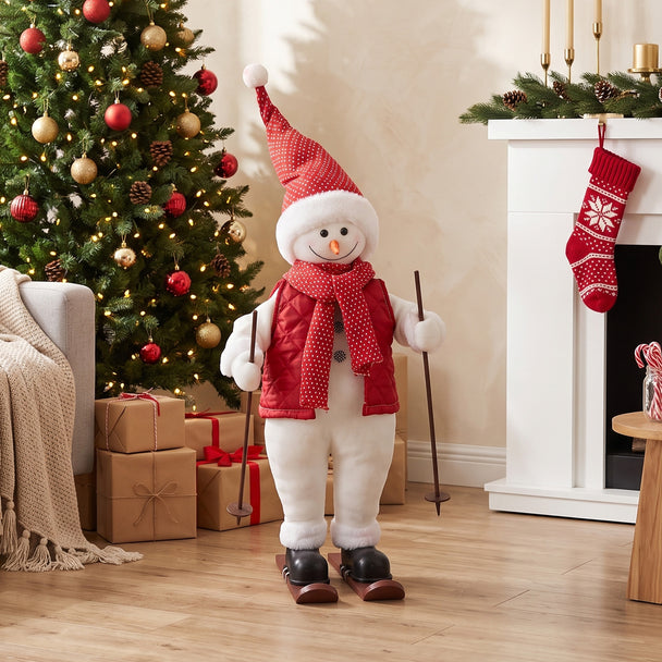 2ft Skiing Santa beside a decorated Christmas tree