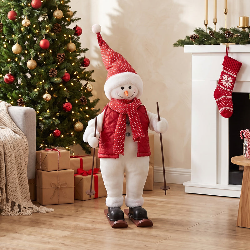 2ft Skiing Santa beside a decorated Christmas tree