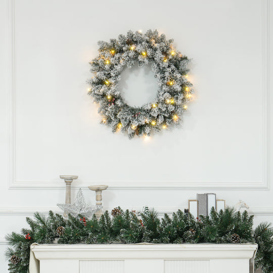60cm Snowy Christmas Wreath hanging in a festive room