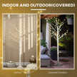 6ft Pre-Lit White Birch Tree shown indoors and in a covered outdoor area