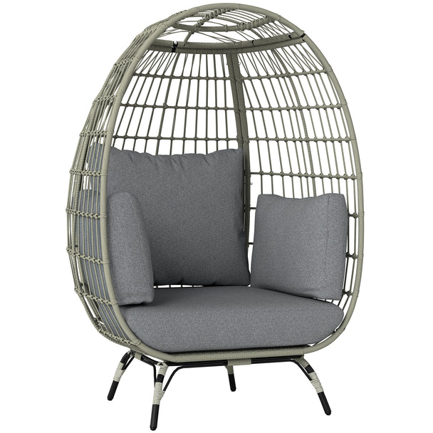 Charcoal grey freestanding rattan egg chair with light grey cushions and side pillows