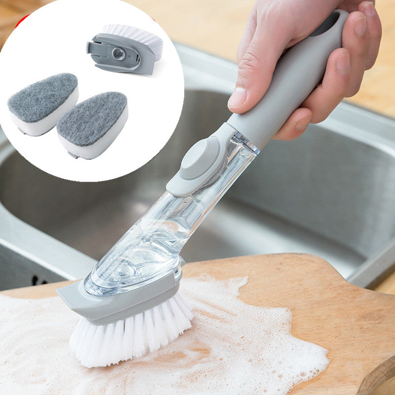 Hand using a scrubber brush to clean a cutting board with a close-up of the brush head.