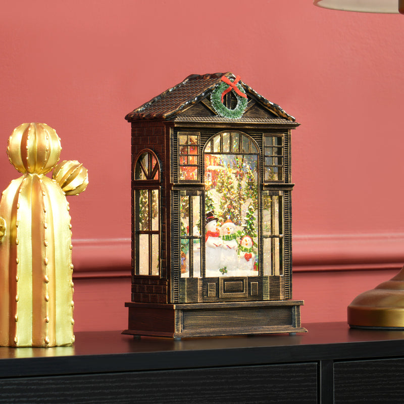 Snow globe lantern displayed on a shelf