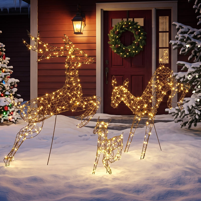 3-Piece Rattan Reindeer Family illuminated outside a decorated home