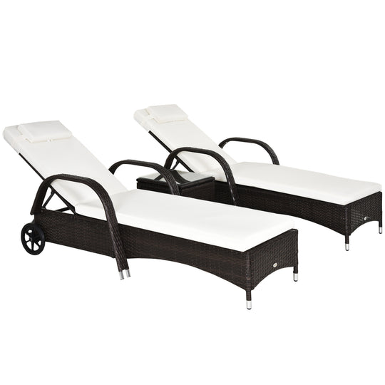 Pair of brown rattan sun loungers with cream cushions and a glass-top side table