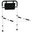 White height-adjustable bed assist rail with foam grip and side storage pocket fitted to a bed