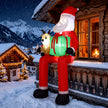 9.3ft Hanging Santa and Reindeer Christmas Inflatable displayed outside a decorated home