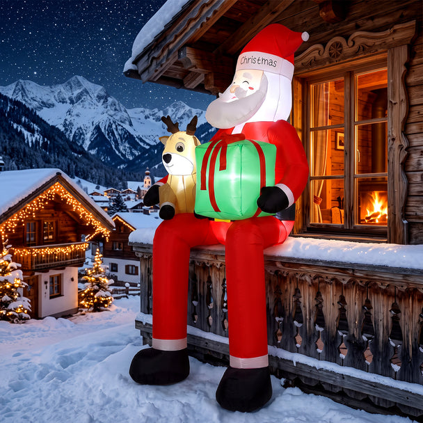 9.3ft Hanging Santa and Reindeer Christmas Inflatable displayed outside a decorated home