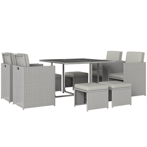 Light grey 9-piece rattan cube dining set with glass-top table, four chairs and four footstools