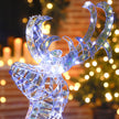 Silver Reindeer and Sleigh Christmas decoration illuminated in a room