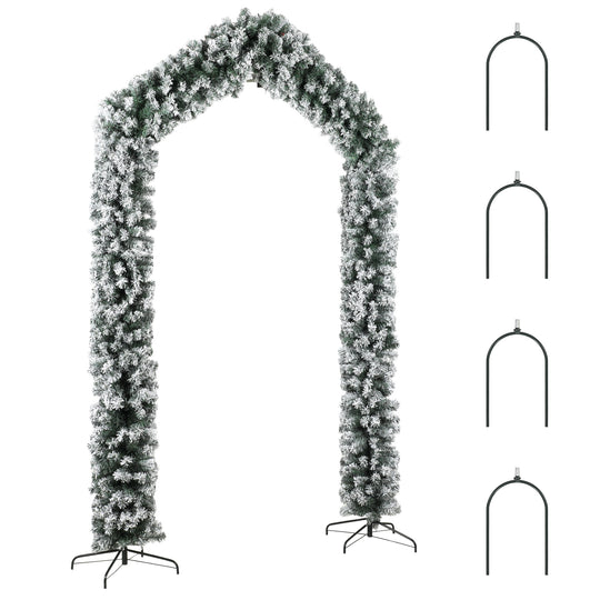 9ft snow-flocked Christmas tree arch framing a single front door