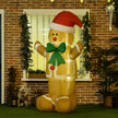 6ft Gingerbread Man in Santa Hat Christmas Inflatable displayed outside a decorated home