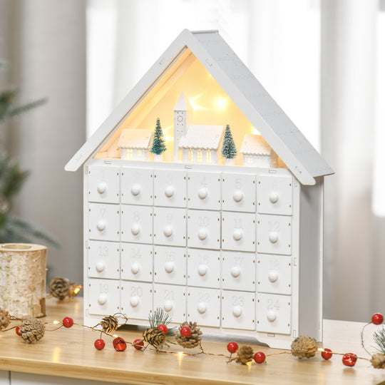 White Wooden House Advent Calendar on a decorated mantel