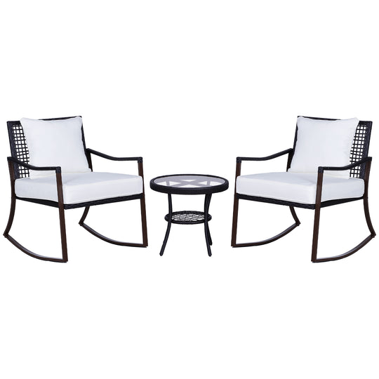 Brown rattan rocking chair bistro set with cream cushions and round glass-top table