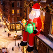 9.3ft Hanging Santa and Reindeer Christmas Inflatable in a festive outdoor setting