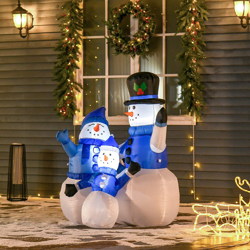 4ft Snowman Family Christmas Inflatable displayed outside a decorated home
