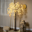 Artificial Pink Blossom Tree illuminated in a room