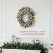 60cm Snowy Christmas Wreath displayed on a wall or door