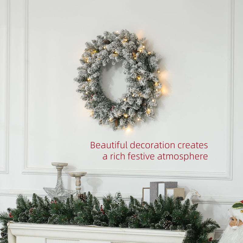 60cm Snowy Christmas Wreath displayed on a wall or door