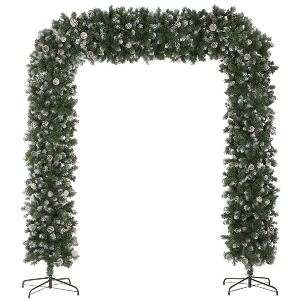 8.2ft wide snow-frosted Christmas tree arch with pine cones around a double doorway
