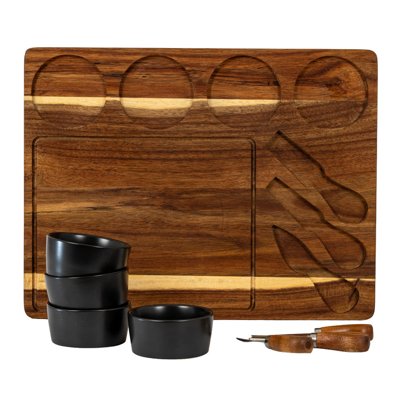 Acacia board showing the bowl and knife recesses, with bowls stacked beside