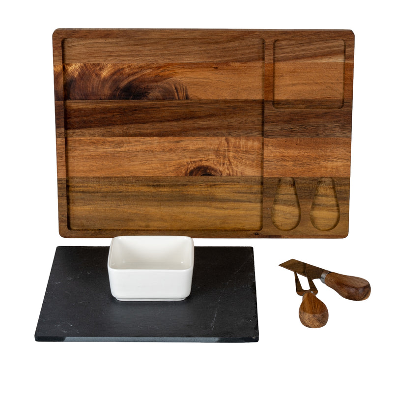 Acacia board with the slate, bowl, knife and fork laid out beside it