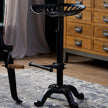 Tractor seat stool column and curved base close-up