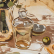Close-up of the painted glass carafe and fruit