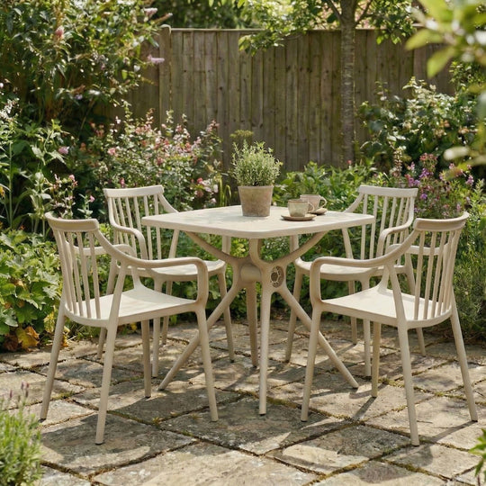 Alto putty grey table with matching chairs on a garden patio