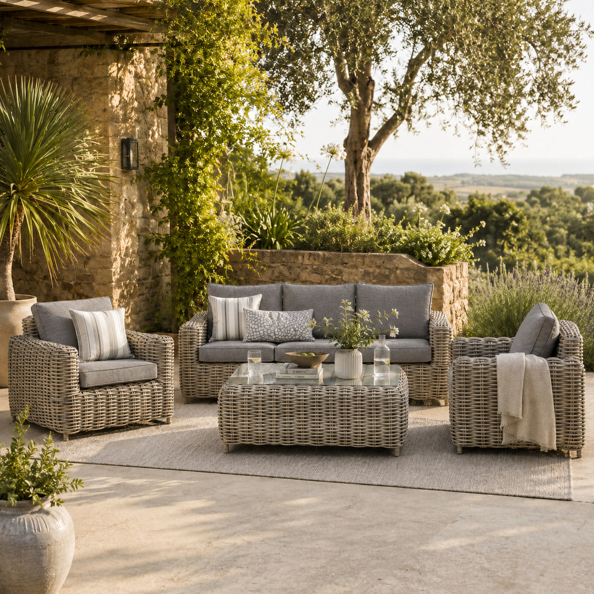 Amalfi wicker sofa, armchairs and coffee table on a sunny terrace
