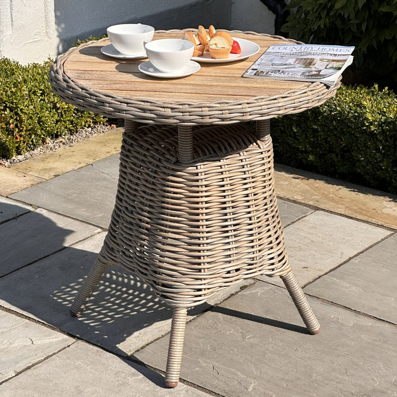 Amalfi round bistro table with a wooden top on a sunny patio