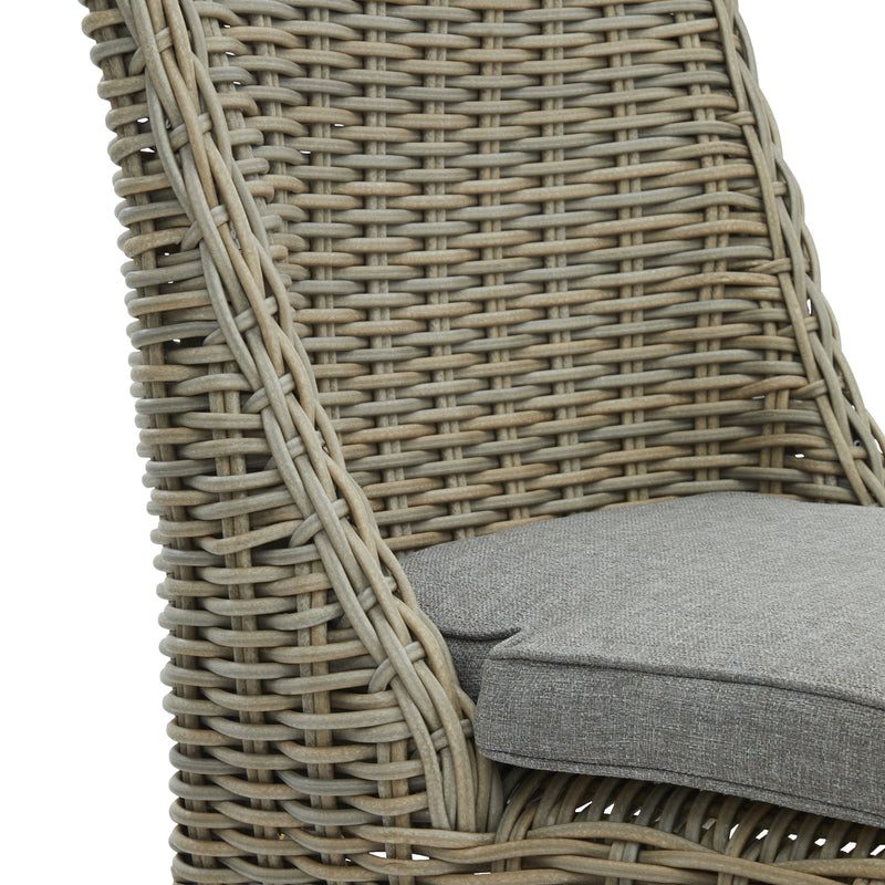 Close-up of the woven wicker back and grey seat cushion