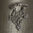 Close-up of the ornate cast side mount